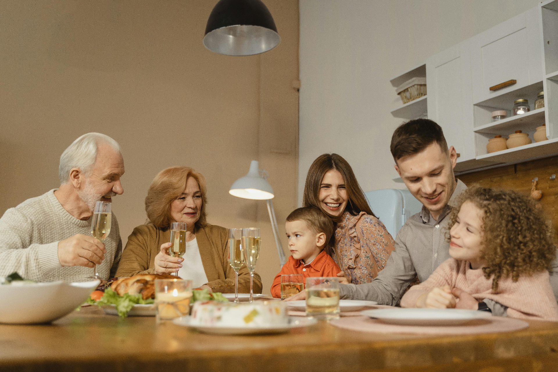 Multi-generational family enjoying dinner together